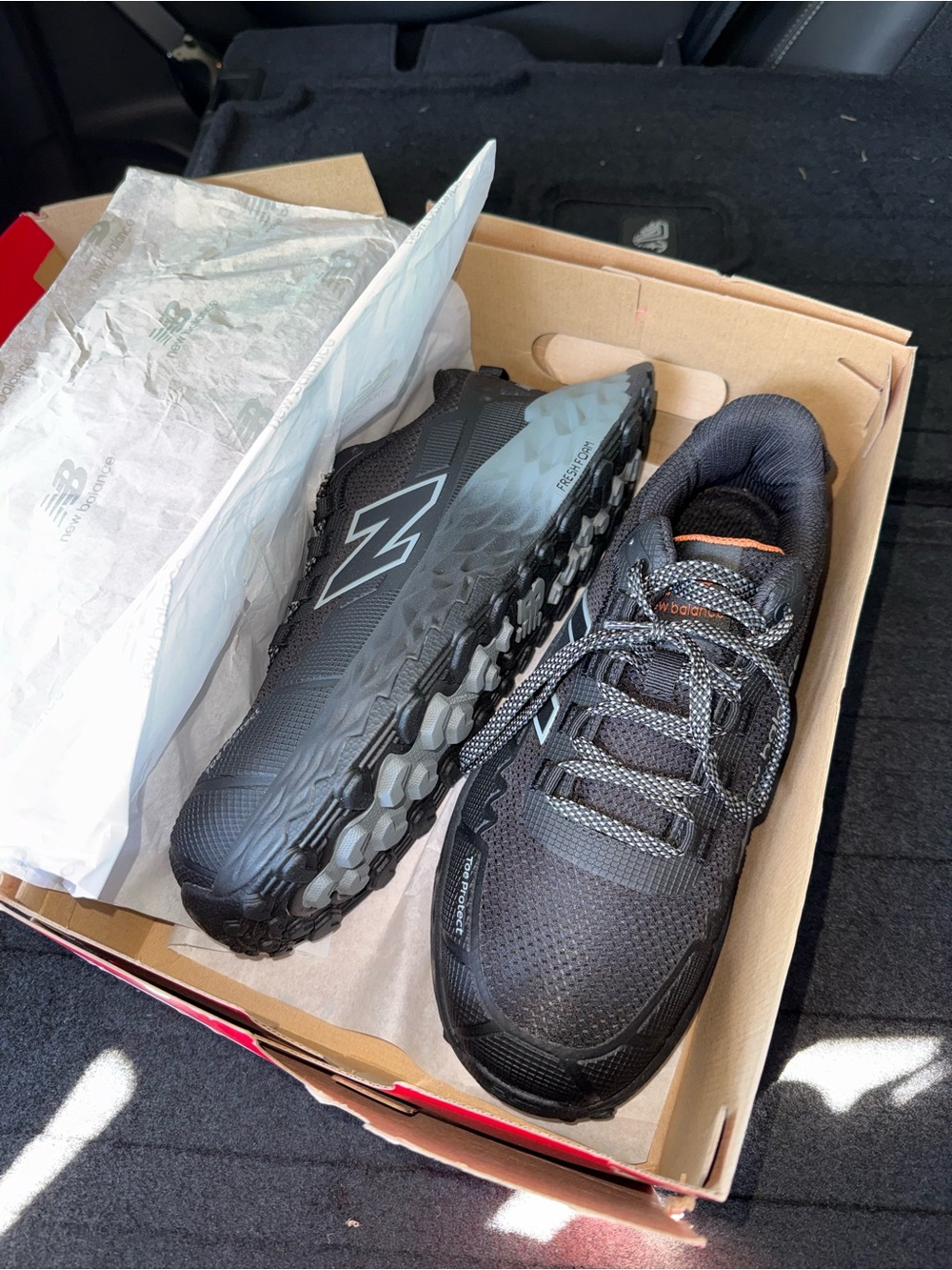 New Balance Men’s Black/teal composite toe work shoes.